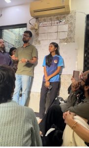 Community center founder and student teacher speaking.